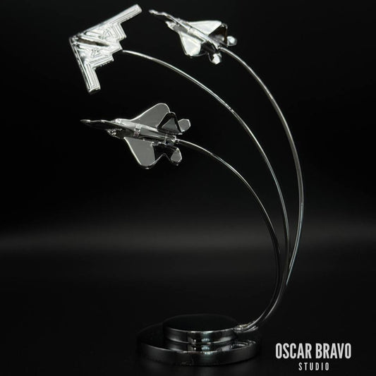 Handcrafted brass aircraft model featuring a B2 Spirit bomber in the center with two F22 fighter jets on each side, chrome-plated finish, 5.7-inch tall aviation desk decor for pilots and collectors.