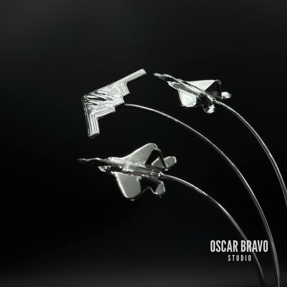Handcrafted brass aircraft model featuring a B2 Spirit bomber in the center with two F22 fighter jets on each side, chrome-plated finish, 5.7-inch tall aviation desk decor for pilots and collectors.
