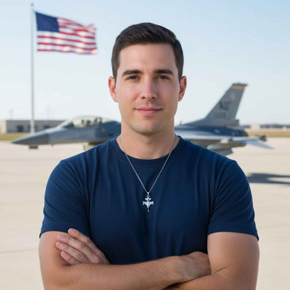 Man standing in front of fighter jets with an American flag in the background
