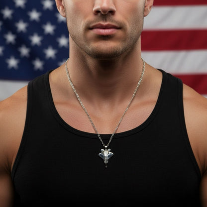 Silver-plated F-22 Raptor Fighter Jet Necklace worn by model with American Flag background. Premium Aviation Jewelry & Pilot Gift.