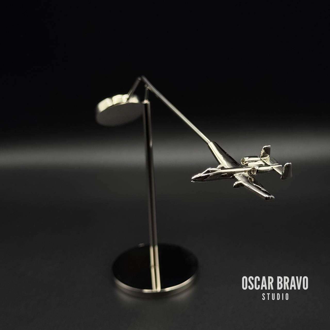 Handcrafted chrome A10 fighter jet balance model – close-up detail