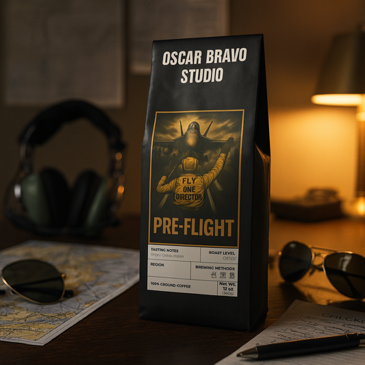 Oscar Bravo Studio Pre-Flight Coffee bag on a pilot’s desk with aviator sunglasses and a folded flight map.