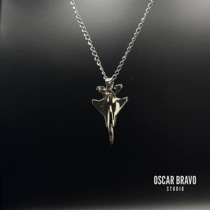 Silver necklace with a unique pendant on a black background, branded 'Oscar Bravo Studio'.